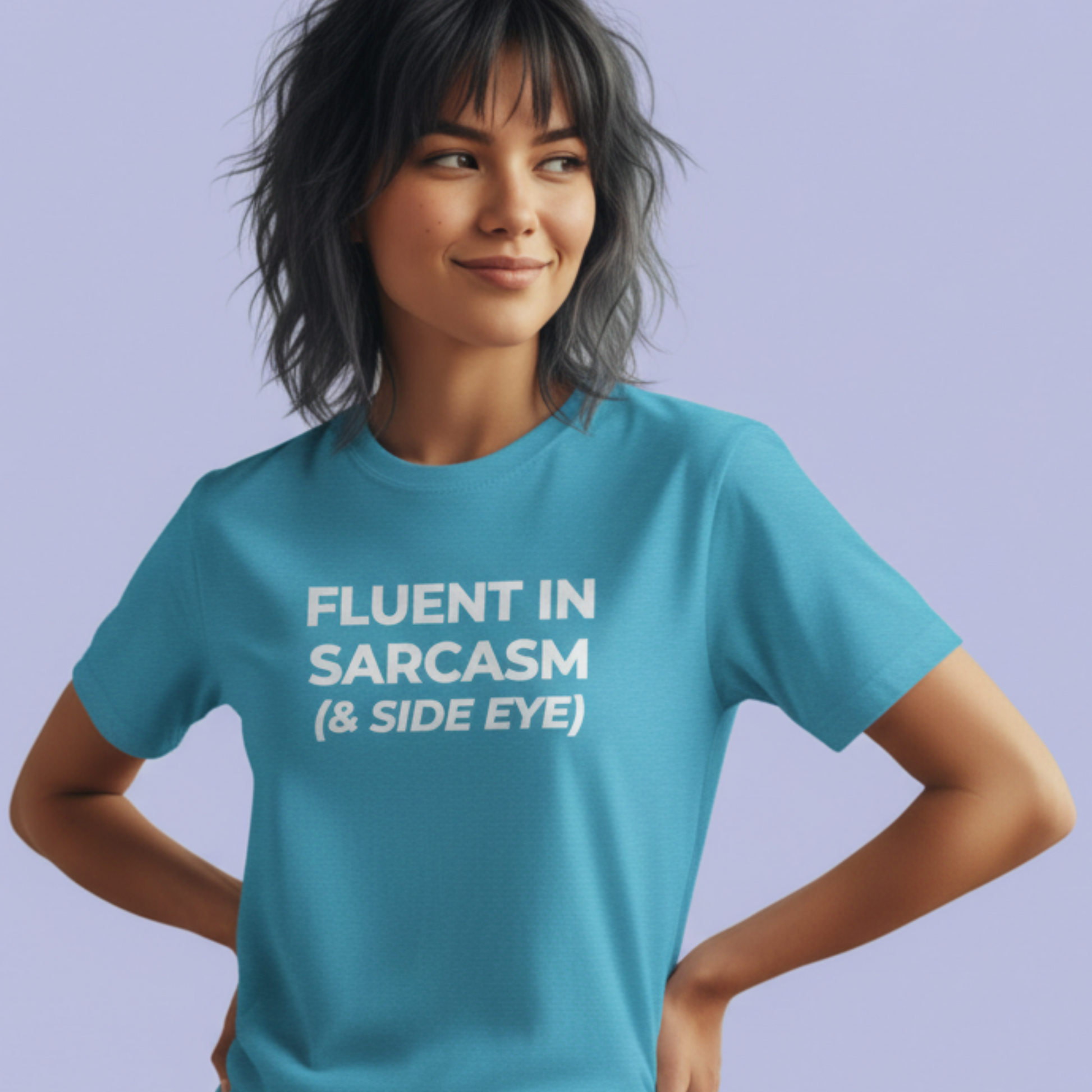 Person wearing a blue t-shirt with 'Fluent in Sarcasm & Side Eye' text on a light purple background